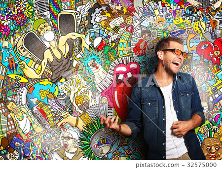 Guy listening to music and simulates play guitar Guy listening to music and simulates play guitar 32575000