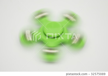 Green Hand Spinner isolated on white background. 32575089