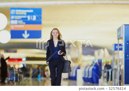 Young business woman in international airport 32576814