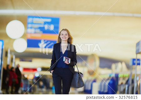 Young business woman in international airport 32576815