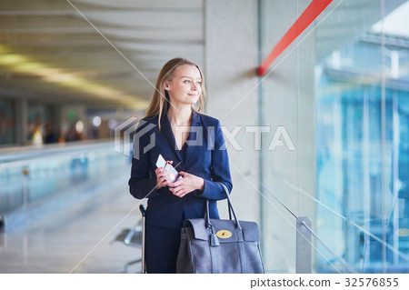 Business woman with passport and boarding pass in international airport 32576855