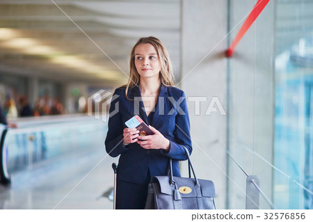 Young business woman in international airport 32576856