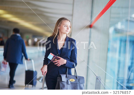 Young business woman in international airport 32576857