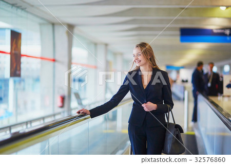Woman on travelator in the international airport 32576860
