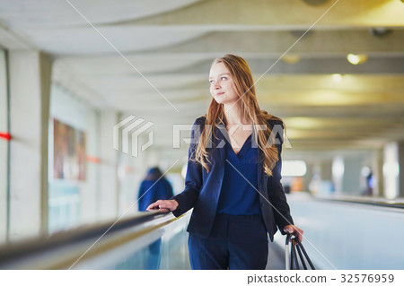 Woman on travelator in the international airport 32576959