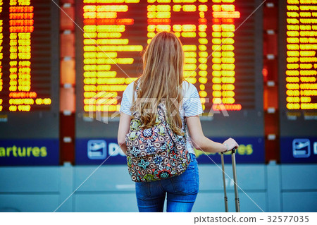Tourist girl in international airport Tourist girl in international airport 32577035