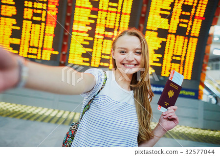 Tourist girl in international airport Tourist girl in international airport 32577044