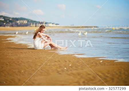 Woman enjoying her vacation by ocean or sea 32577299