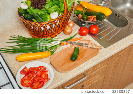 vegetables and greens food in kitchen interior vegetables and greens food in kitchen interior 32580837