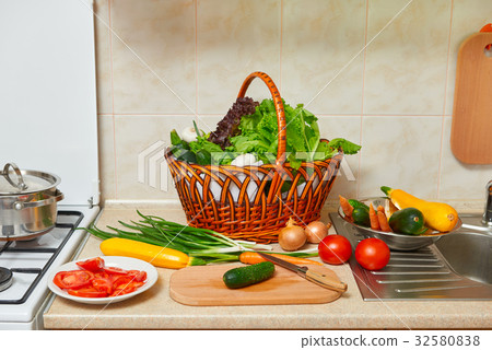 vegetables and greens food in kitchen interior vegetables and greens food in kitchen interior 32580838