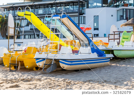 pedal catamarans for recreation on sand beach 32582079