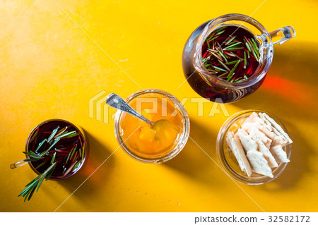 Pineapple jam, tea with rosemary and biscuits on a Pineapple jam, tea with rosemary and biscuits on a 32582172