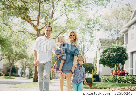 young family on the street 32590243