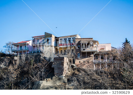 Wooden houses with decorated balconies Wooden houses with decorated balconies 32590629