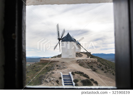 White old windmill on the hill near Consuegra 32590839