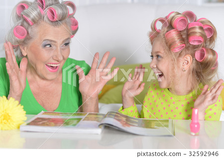 woman and granddaughter doing make up woman and granddaughter doing make up 32592946