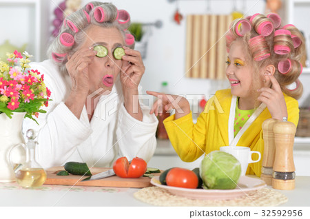 woman making mask from cucumber woman making mask from cucumber 32592956
