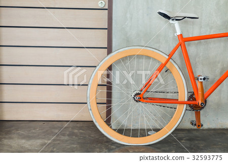 orange bicycle parked decorate interior 32593775