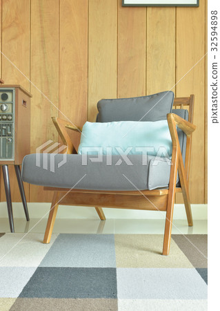 Retro style armchair with wooden wall Retro style armchair with wooden wall 32594898