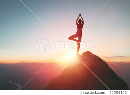 Woman practices yoga Woman practices yoga 32595132
