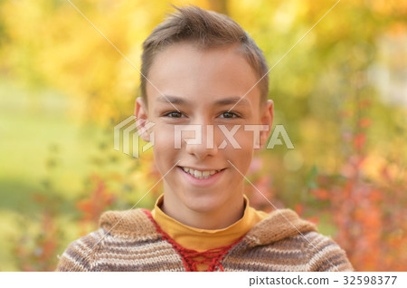smiling boy posing 32598377