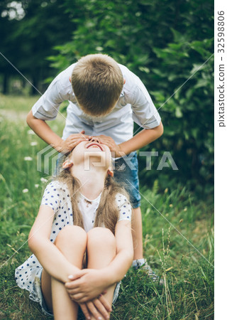 kids playing in the park, guess who, closing each kids playing in the park, guess who, closing each 32598806
