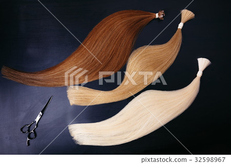 hair extensions of three colors on a dark hair extensions of three colors on a dark 32598967