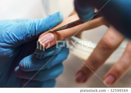 Manicure process in beauty salon, close up Manicure process in beauty salon, close up 32599584