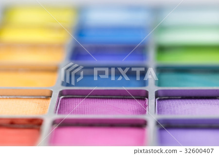pallet of colored eye shadows, texture. Shallow pallet of colored eye shadows, texture. Shallow 32600407