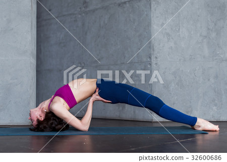 Side view of skinny young yogini standing in yoga Side view of skinny young yogini standing in yoga 32600686