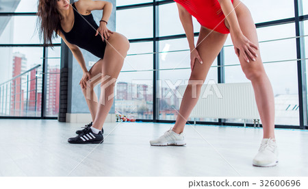 Cropped image of two beautiful female bodies 32600696