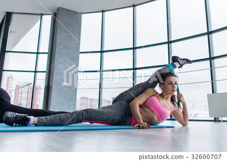 Low angle shot of young female athlete doing Low angle shot of young female athlete doing 32600707