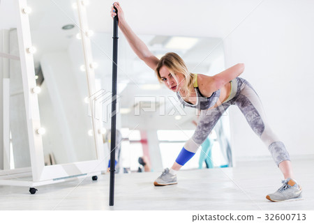Woman doing stretching exercise for hamstrings and 32600713