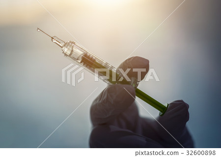 Syringe, medical injection in hand. Vaccination equipment. 32600898