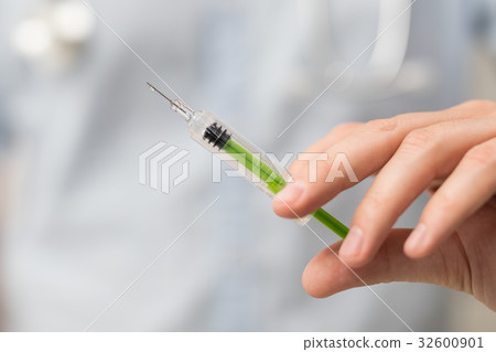Syringe, medical injection in hand. Vaccination equipment. Syringe, medical injection in hand. Vaccination equipment. 32600901