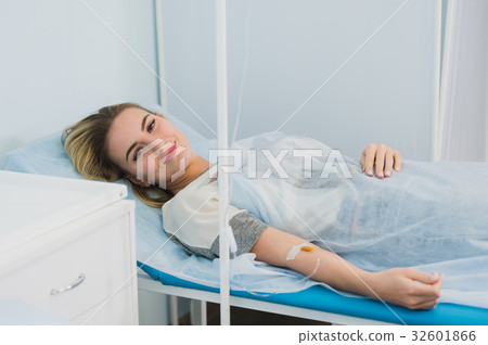 Woman Lying Down In Hospital Bed and smiling. Woman Lying Down In Hospital Bed and smiling. 32601866