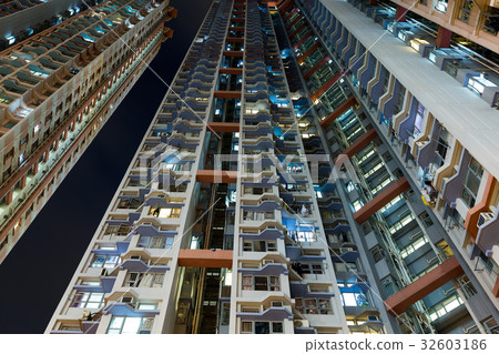 Tall building from low angle at night 32603186