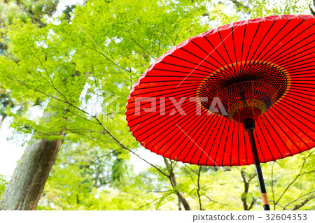 Red umbrella with green tree Red umbrella with green tree 32604353