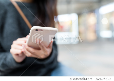 Woman working on smart phone 32606498