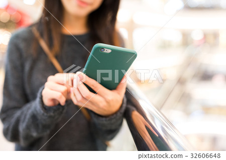 Woman using mobile phone 32606648