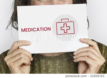 Women holding a card with healthcare concept Women holding a card with healthcare concept 32609103