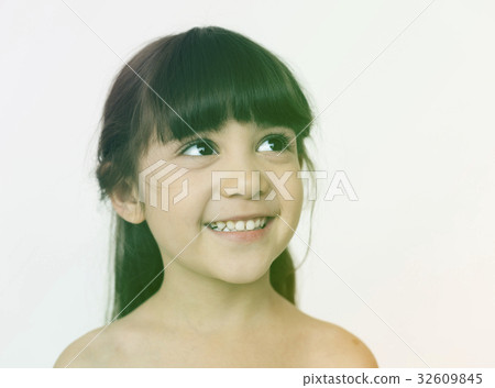 Young girl smiling and looking Young girl smiling and looking 32609845