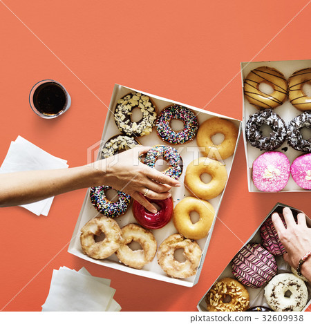 Group of hands holding sweeten donut dessert Group of hands holding sweeten donut dessert 32609938