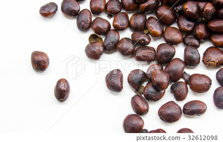 Close up roast Tamarind seeds on white background. 32612098