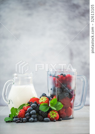 Blender with fruits and jar of milk for smoothie 32613105