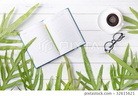 calendar book and coffee with green fern leaf calendar book and coffee with green fern leaf 32615621