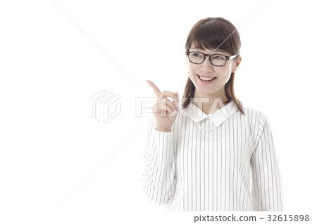 A woman with a pointing pose A woman with a pointing pose 32615898