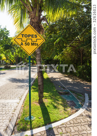 Topes speed bump sign at caribbean stree 32616813