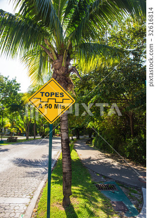 Topes speed bump sign at caribbean stree 32616814