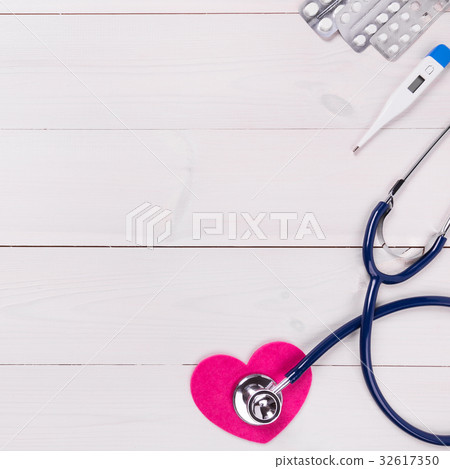 Medical tools on wooden background 32617350